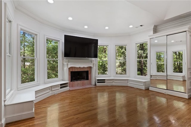 4340 Candacraig, Johns Creek, GA 30022 - unfurnished living room with healthy amount of natural light, a premium fireplace, ornamental molding, wood finished floors, and recessed lighting