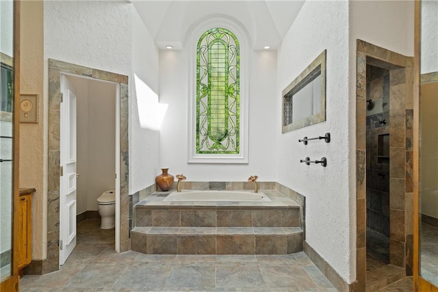 4340 Candacraig, Johns Creek, GA 30022 - bathroom with a garden tub, toilet, a walk in shower, stone finish flooring, and a textured wall