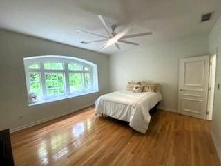 4340 Candacraig, Johns Creek, GA 30022 - bedroom featuring wood finished floors and a ceiling fan