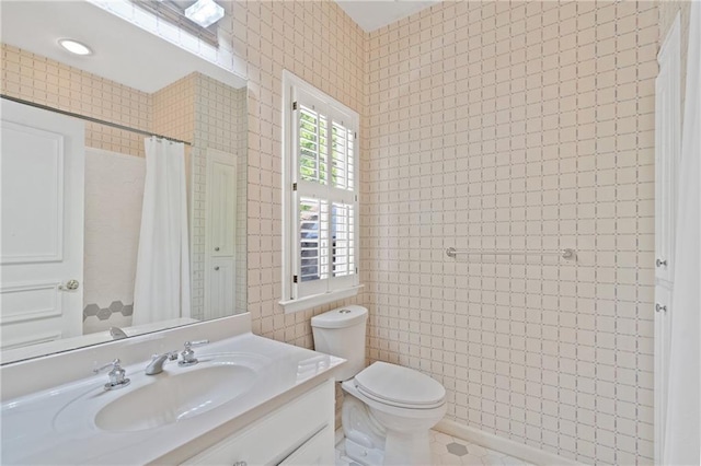 4340 Candacraig, Johns Creek, GA 30022 - bathroom with vanity, toilet, tiled shower, and tile walls