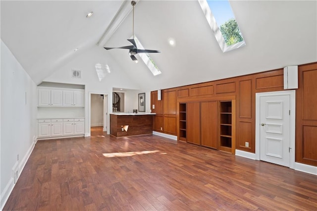4340 Candacraig, Johns Creek, GA 30022 - unfurnished living room with high vaulted ceiling, a skylight, beam ceiling, dark wood-type flooring, and a ceiling fan