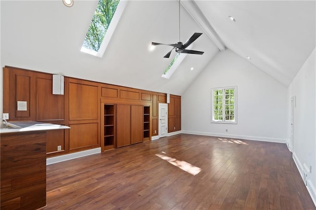 4340 Candacraig, Johns Creek, GA 30022 - unfurnished living room with a skylight, dark wood-type flooring, a ceiling fan, and baseboards