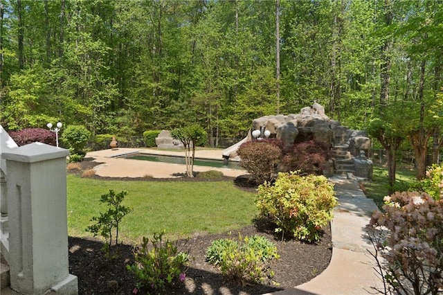 4340 Candacraig, Johns Creek, GA 30022 - view of grassy yard with an outdoor pool and a wooded view