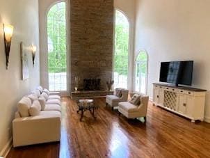 4340 Candacraig, Johns Creek, GA 30022 - living area with wood finished floors, healthy amount of natural light, and a fireplace
