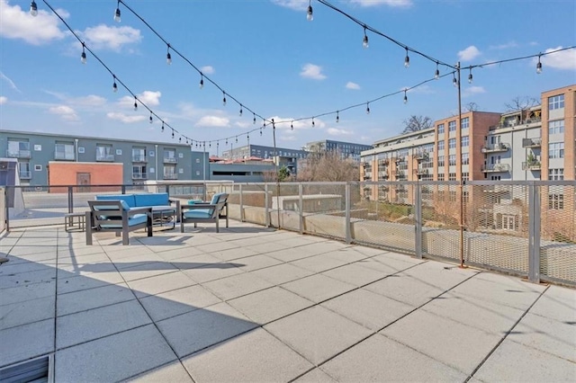 view of patio with fence and an outdoor hangout area