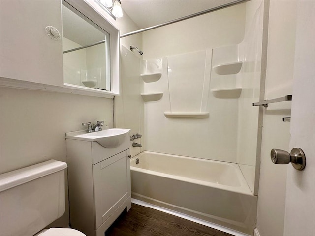 full bathroom with wood-type flooring, vanity, shower / bath combination, and toilet