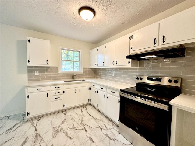 kitchen with stainless steel range with electric cooktop, sink, decorative backsplash, a textured ceiling, and white cabinetry