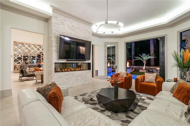 living room featuring a fireplace and ornamental molding