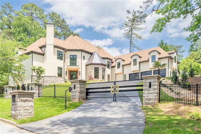 french country style house featuring a front lawn