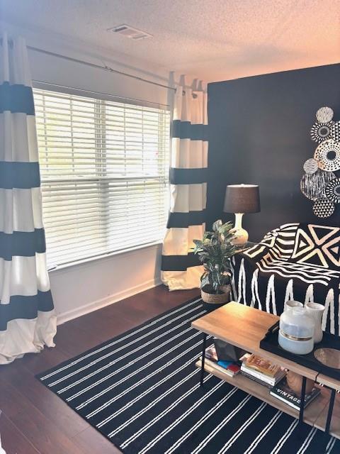 7178 Glaspie Way, Atlanta, GA 30349 - living room with a textured ceiling and wood finished floors