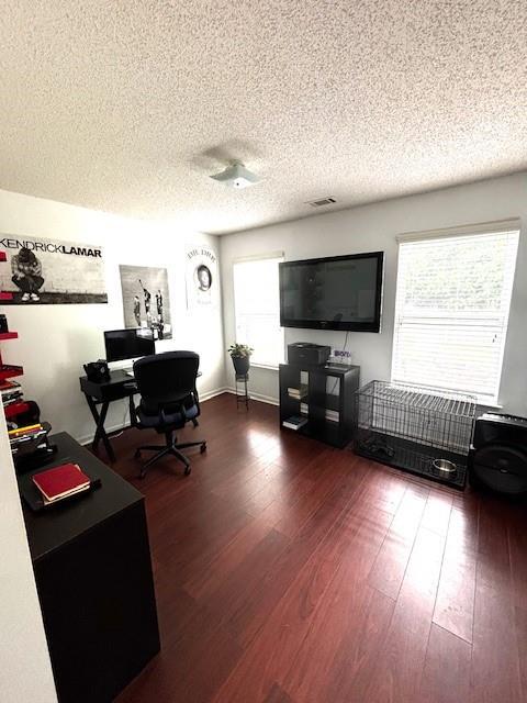 7178 Glaspie Way, Atlanta, GA 30349 - office with a textured ceiling, healthy amount of natural light, and wood finished floors