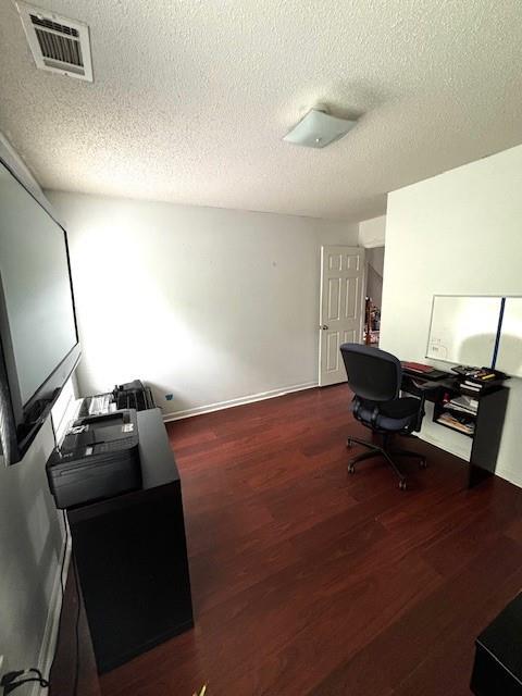 7178 Glaspie Way, Atlanta, GA 30349 - office area with wood finished floors and a textured ceiling