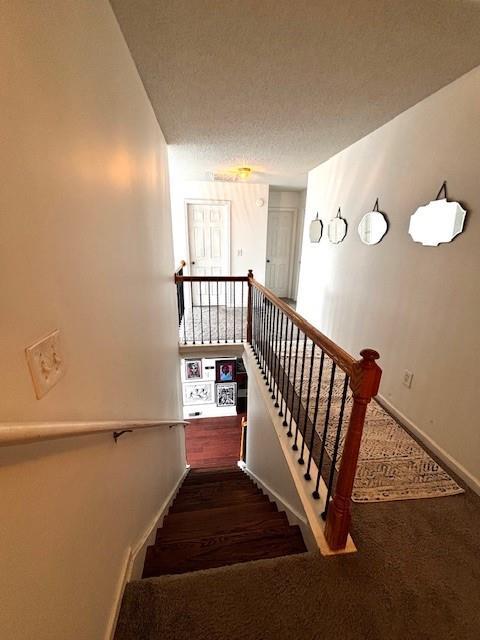 7178 Glaspie Way, Atlanta, GA 30349 - stairway with carpet flooring and baseboards
