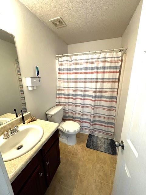 7178 Glaspie Way, Atlanta, GA 30349 - full bathroom featuring vanity, a textured ceiling, and tile patterned flooring