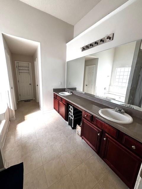 7178 Glaspie Way, Atlanta, GA 30349 - full bathroom with double vanity and tile patterned floors