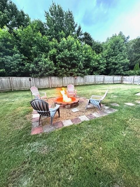 7178 Glaspie Way, Atlanta, GA 30349 - fenced backyard featuring an outdoor fire pit