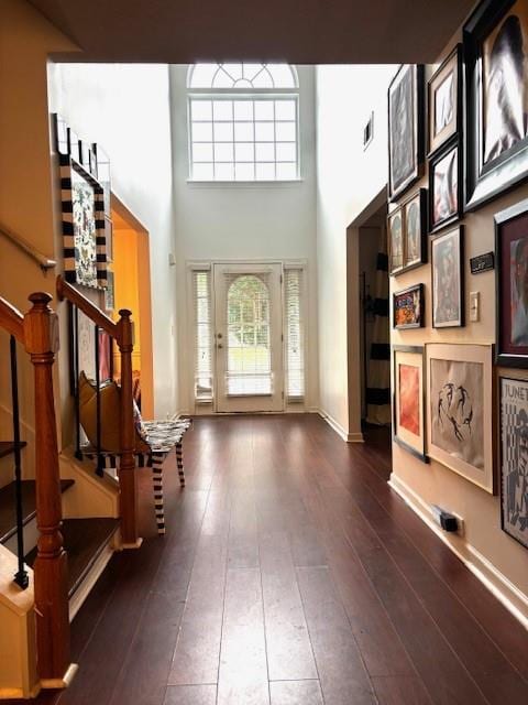 7178 Glaspie Way, Atlanta, GA 30349 - foyer with stairs, dark wood-type flooring, and a towering ceiling