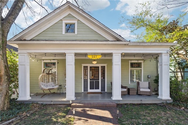 doorway to property featuring a porch