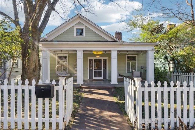 greek revival inspired property featuring covered porch