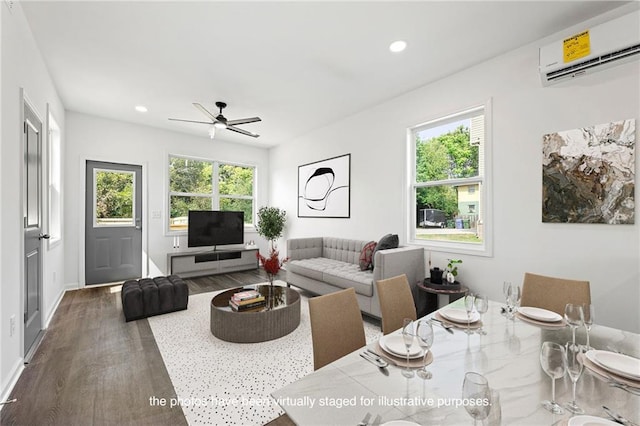 living room with dark hardwood / wood-style floors, a wall mounted AC, and ceiling fan