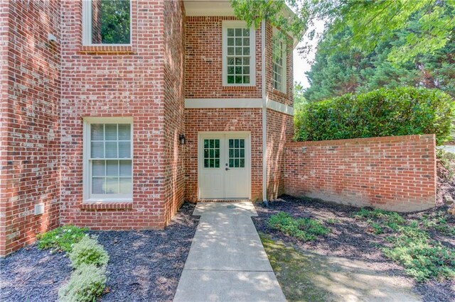 1485 Rolling Links Dr, Alpharetta, GA 30004 - back of house with stairway, brick siding, a wooden deck, and a lawn