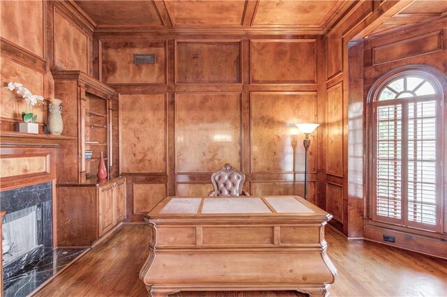 1485 Rolling Links Dr, Alpharetta, GA 30004 - home office featuring a fireplace, wood finished floors, a decorative wall, wood walls, and wooden ceiling