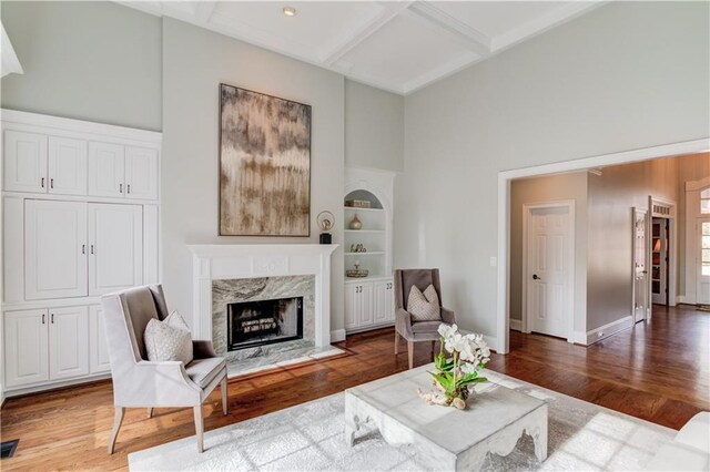 1485 Rolling Links Dr, Alpharetta, GA 30004 - living room with a high end fireplace, coffered ceiling, light wood-type flooring, and beam ceiling