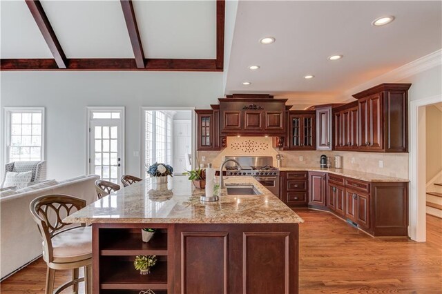 1485 Rolling Links Dr, Alpharetta, GA 30004 - kitchen with recessed lighting, open shelves, a sink, high end stainless steel range, and glass insert cabinets