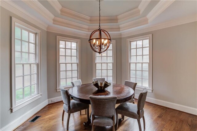 1485 Rolling Links Dr, Alpharetta, GA 30004 - dining room with a chandelier, baseboards, wood finished floors, and crown molding