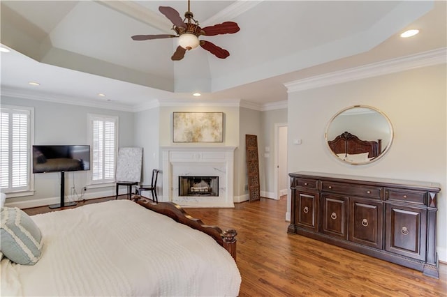 1485 Rolling Links Dr, Alpharetta, GA 30004 - bedroom with a raised ceiling, light wood-style flooring, a fireplace, recessed lighting, and ornamental molding