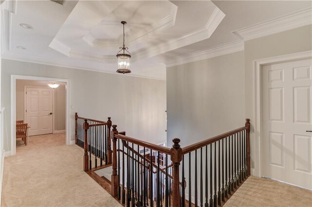 1485 Rolling Links Dr, Alpharetta, GA 30004 - hallway with an upstairs landing, carpet floors, ornamental molding, a tray ceiling, and baseboards