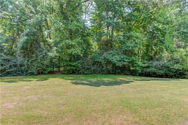 1485 Rolling Links Dr, Alpharetta, GA 30004 - view of green lawn with a wooded view
