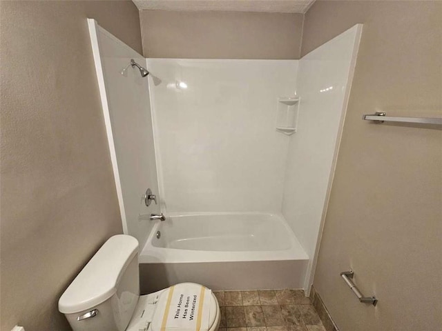 bathroom with shower / bath combination and toilet