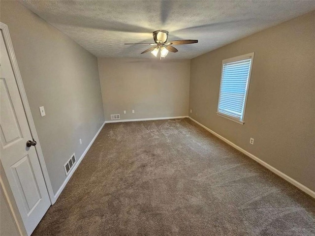 carpeted empty room featuring a textured ceiling and ceiling fan