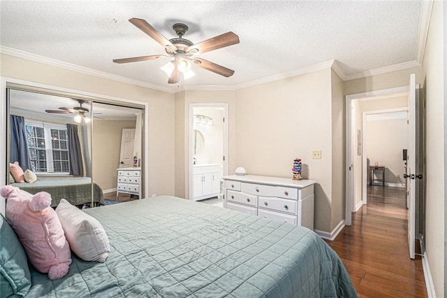 bedroom with ornamental molding, ceiling fan, a textured ceiling, and dark hardwood / wood-style flooring