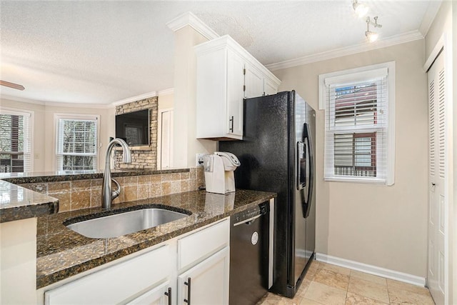 kitchen with sink, dishwasher, white cabinetry, dark stone countertops, and ornamental molding