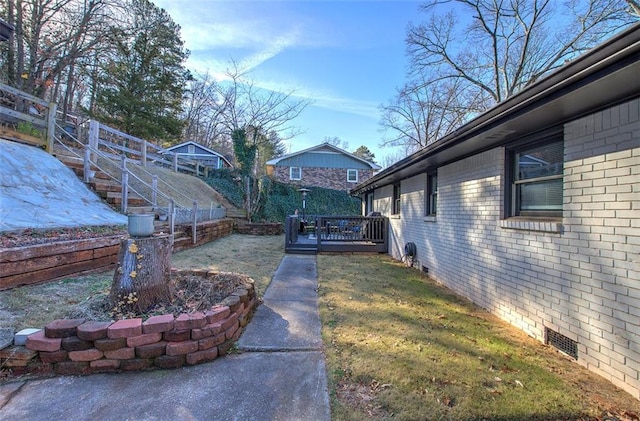 view of yard with a deck