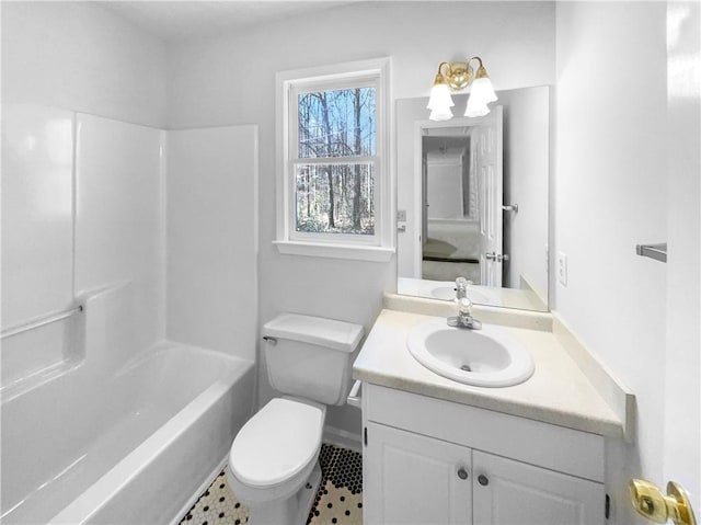 bathroom with shower / bathtub combination, vanity, and toilet