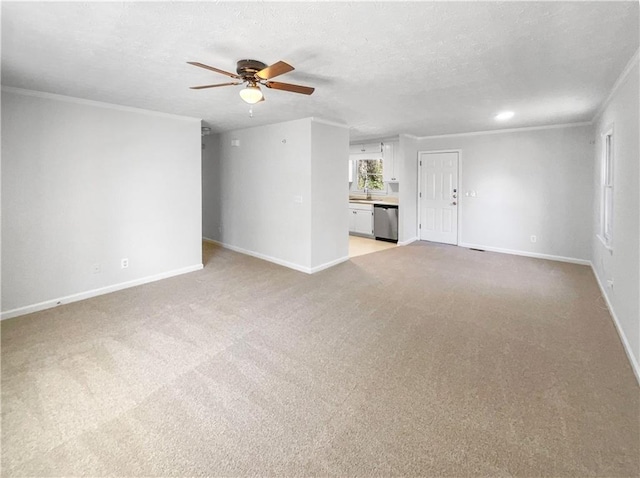 unfurnished living room featuring a textured ceiling, baseboards, crown molding, and light colored carpet