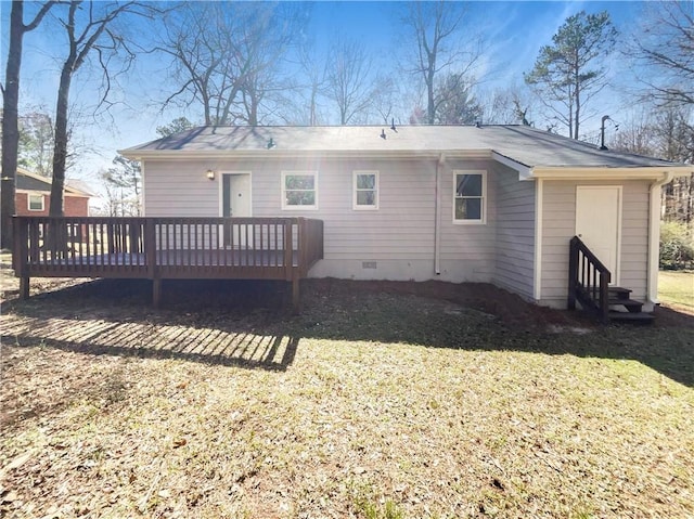 back of house featuring crawl space, a lawn, and a deck