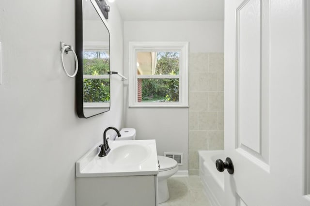 2519 Miriam Ln, Decatur, GA 30032 - bathroom featuring a wealth of natural light, visible vents, toilet, and vanity