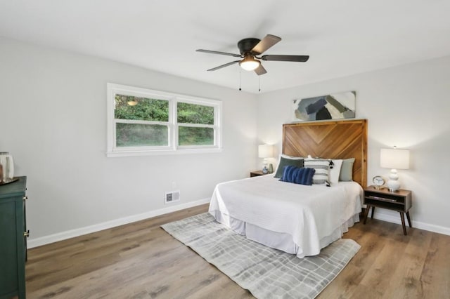 2519 Miriam Ln, Decatur, GA 30032 - bedroom with wood finished floors, baseboards, ceiling fan, and visible vents