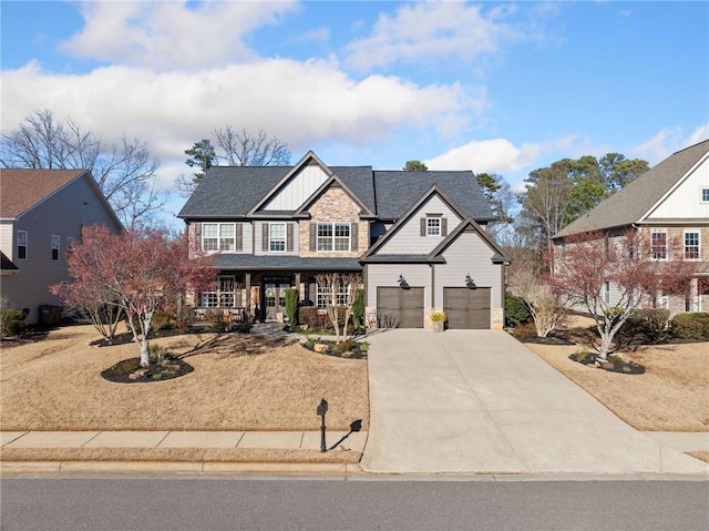 view of front of property featuring driveway, stone siding, an attached garage, a porch, and board and batten siding