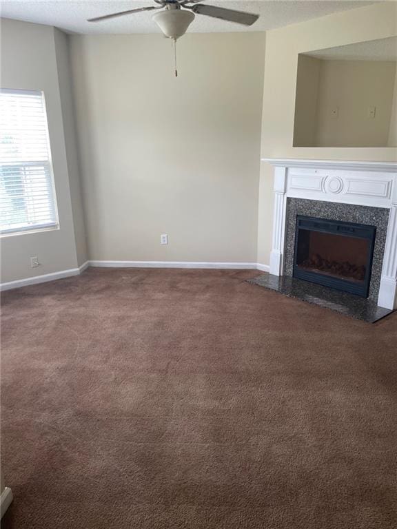 8170 Oakley Cir, Union City, GA 30291 - unfurnished living room with ceiling fan, carpet, a high end fireplace, and a textured ceiling