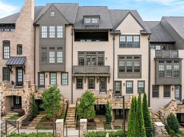 view of front of home with a balcony