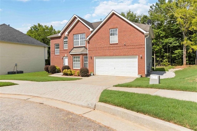 1127 Oak Hollow Ct, Hampton, GA 30228 - traditional-style house featuring concrete driveway, brick siding, an attached garage, and a front yard