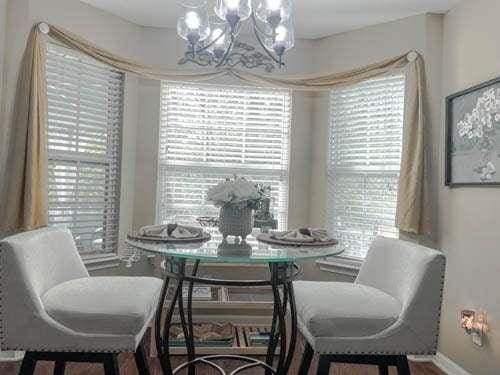 1127 Oak Hollow Ct, Hampton, GA 30228 - dining space with a chandelier, healthy amount of natural light, and baseboards