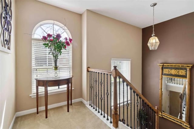 1127 Oak Hollow Ct, Hampton, GA 30228 - hallway with carpet, an upstairs landing, and baseboards
