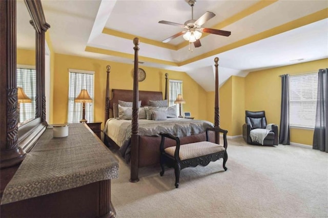 1127 Oak Hollow Ct, Hampton, GA 30228 - bedroom with light carpet, baseboards, a ceiling fan, and a tray ceiling