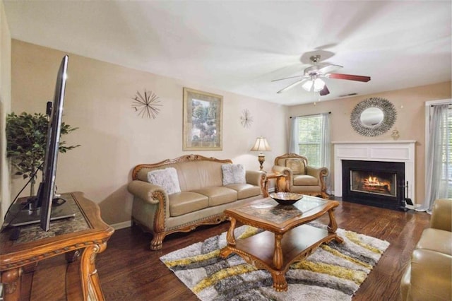 1127 Oak Hollow Ct, Hampton, GA 30228 - living room with a fireplace with flush hearth, ceiling fan, wood finished floors, and baseboards